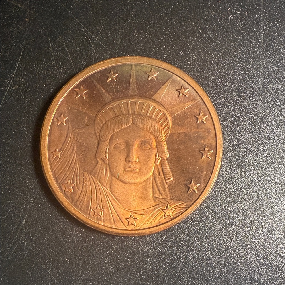 commemorative coin featuring the Statue of Liberty.